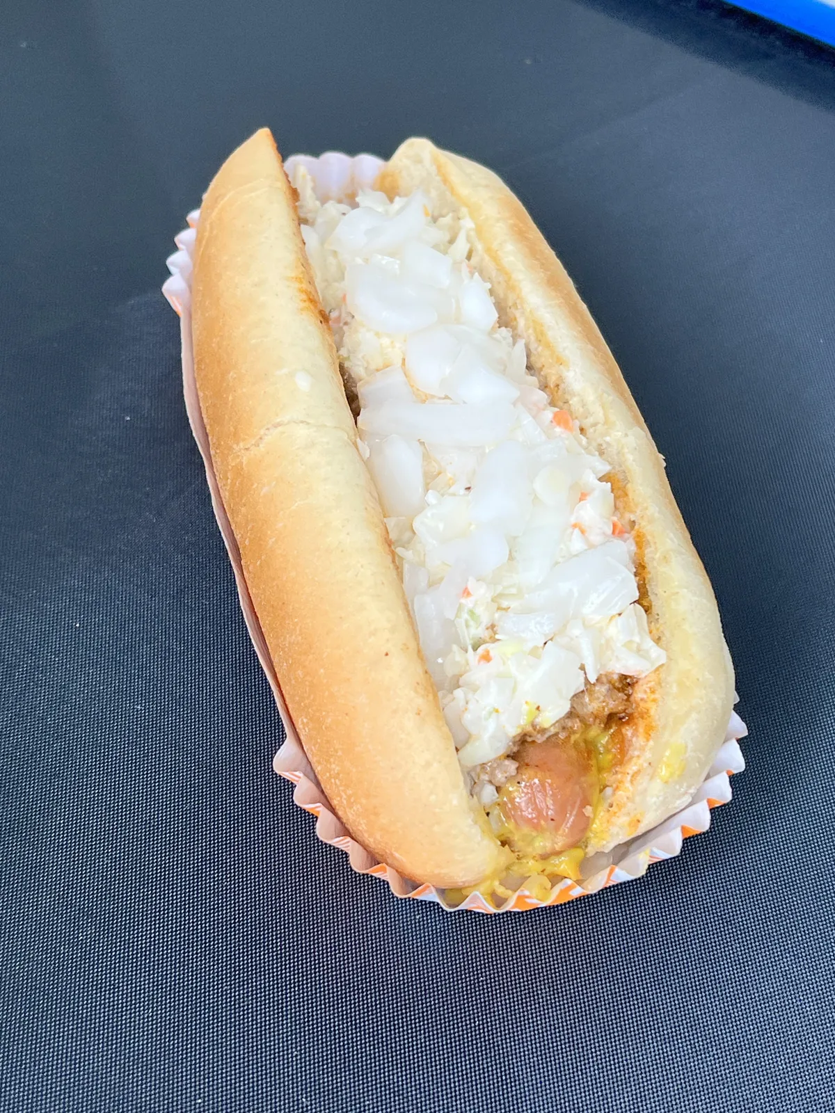 Hot dog piled with creamy coleslaw