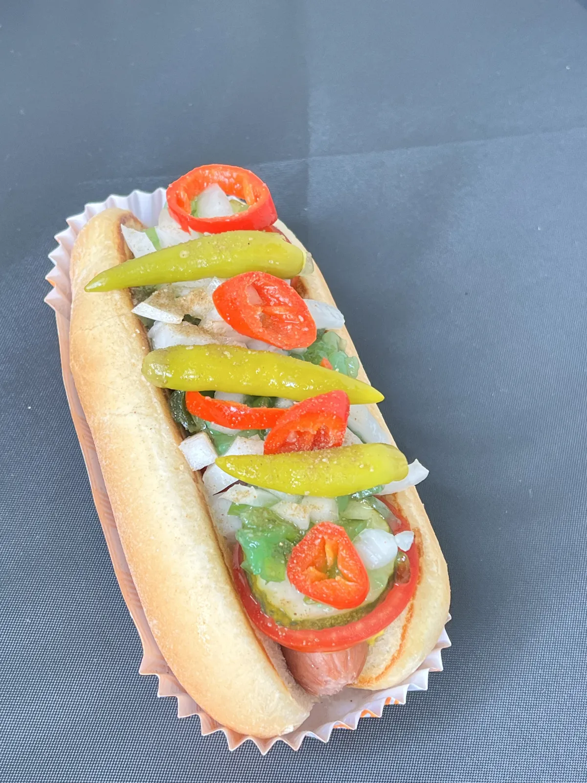 Chicago-style Franken Dog with sport peppers, tomato, onion, and relish